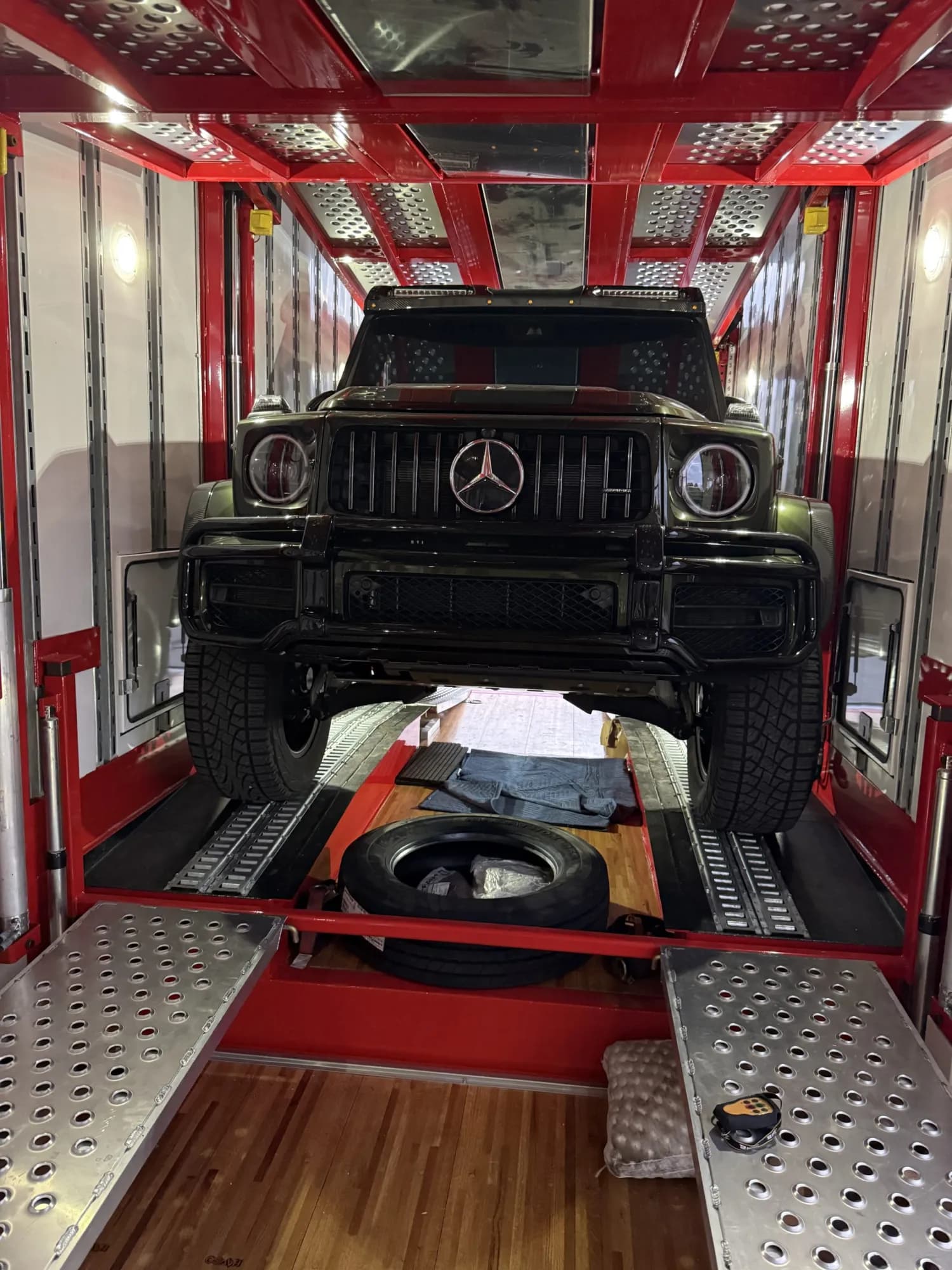 Vehicles secured inside an enclosed transport trailer